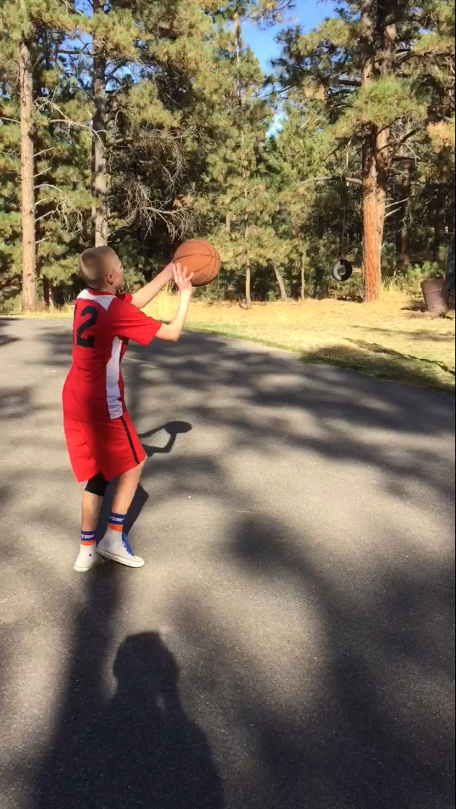 Nate Lipka practicing basketball outdoors